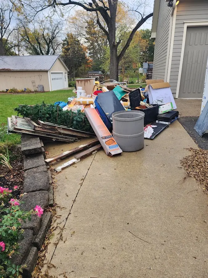 Dumpster being loaded with debris for Estate Cleanout Dumpster Rental in American Canyon